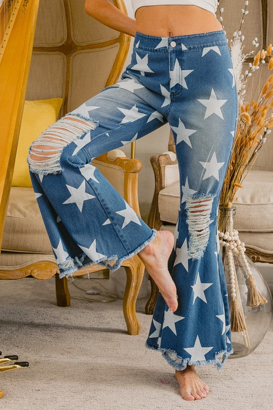 Distressed crop star print flare jeans